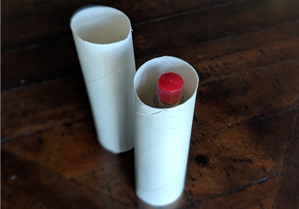 tobasco sauce inside a paper towel tube