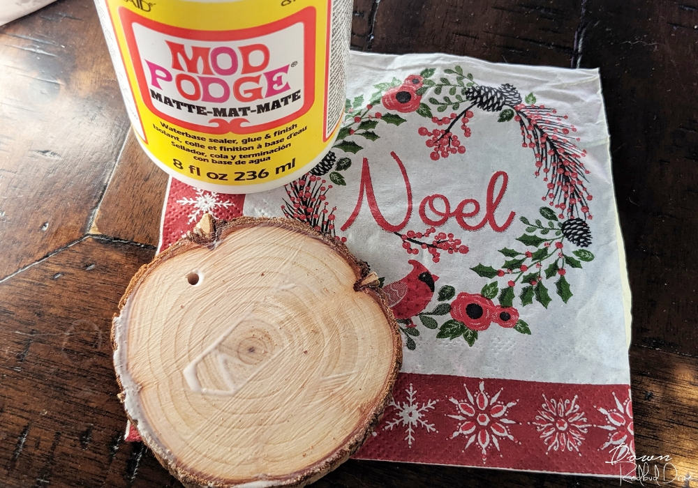 wood slice ornament with a christmas napkin and Mod Podge