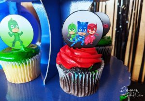 PJ Masks cupcakes on a cupcake stand