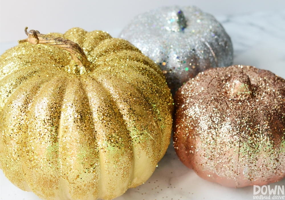 Finished glittered DIY Pumpkins in gold, silver and bronze.