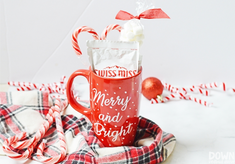 Close up of a DIY Hot Cocoa Gift in a red "Merry and Bright" Christmas mug.