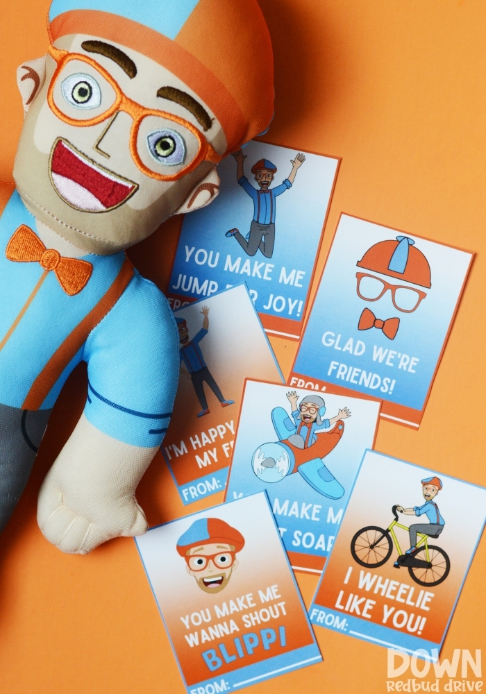 Printable Blippi Valentines shown with a Blippi doll plush.