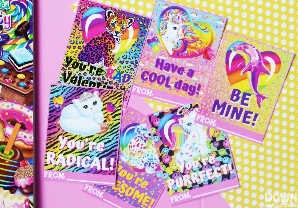 Overhead shot of the printed and cut out Lisa Frank Valentines.