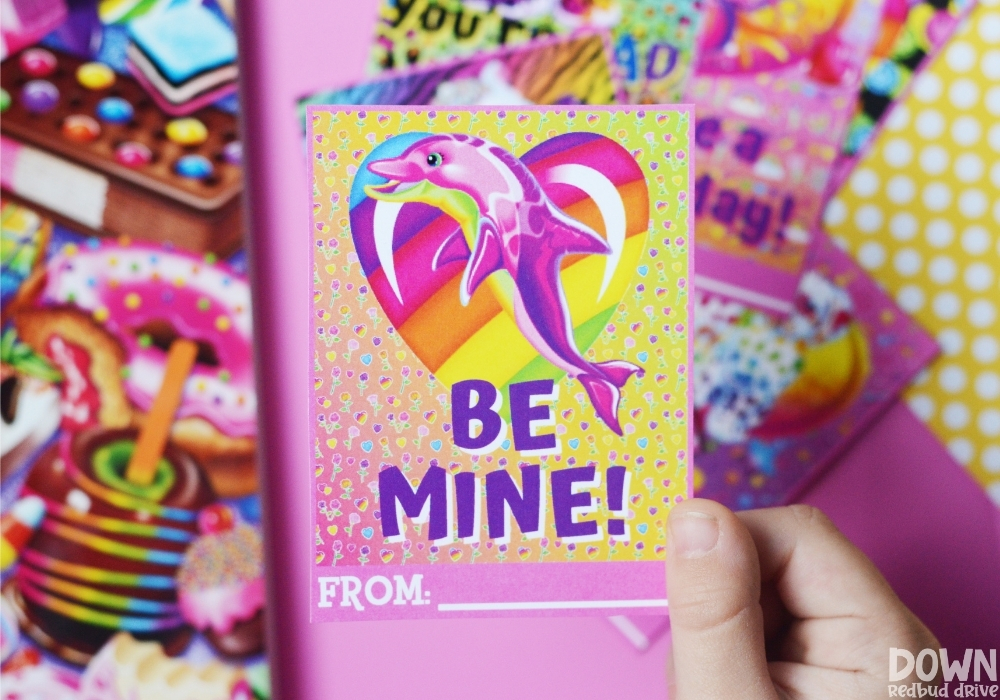 Close up of a Lisa Frank Valentine that says "Be mine!"