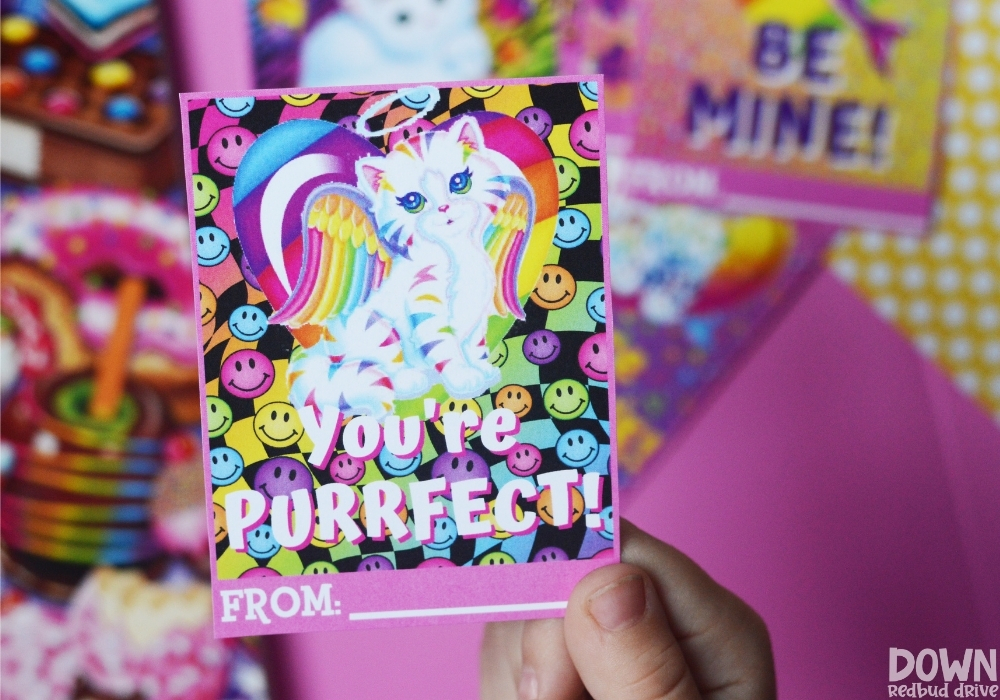 Close up of a Lisa Frank Valentine that says "You're Purrfect!"