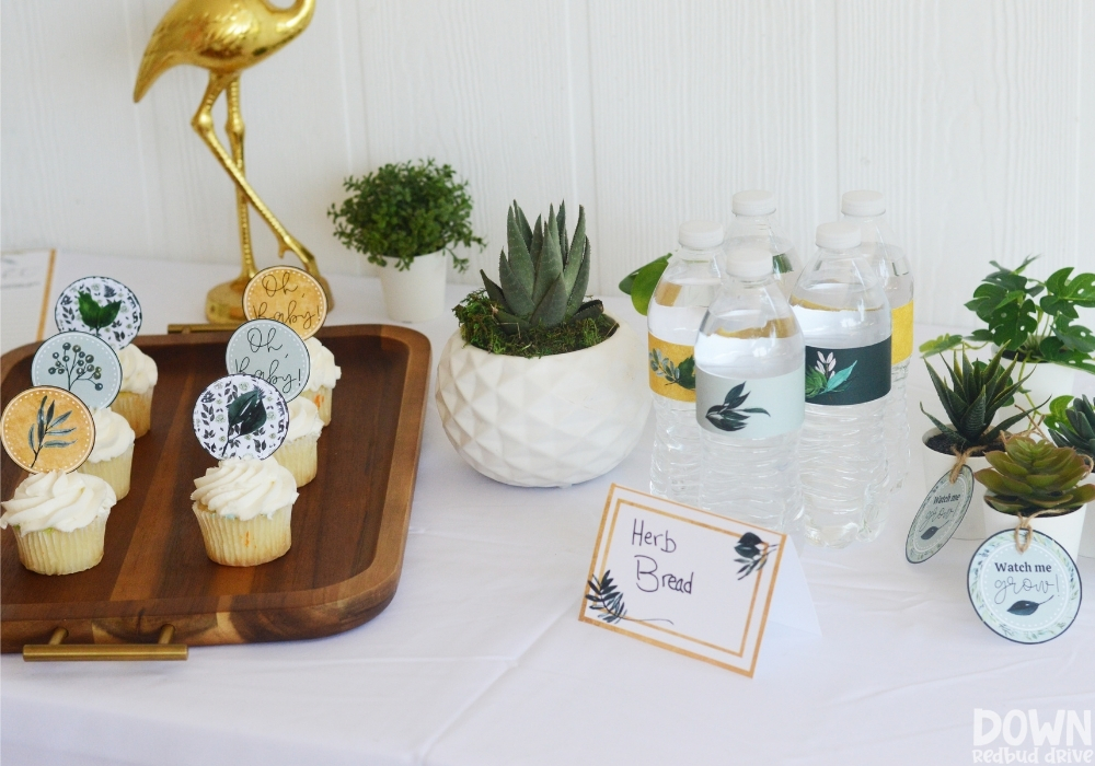 A wide closeup of the food table for the DIY Greenery Baby Shower.