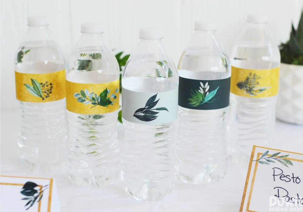 Wide close up of the greenery themed water bottle labels.