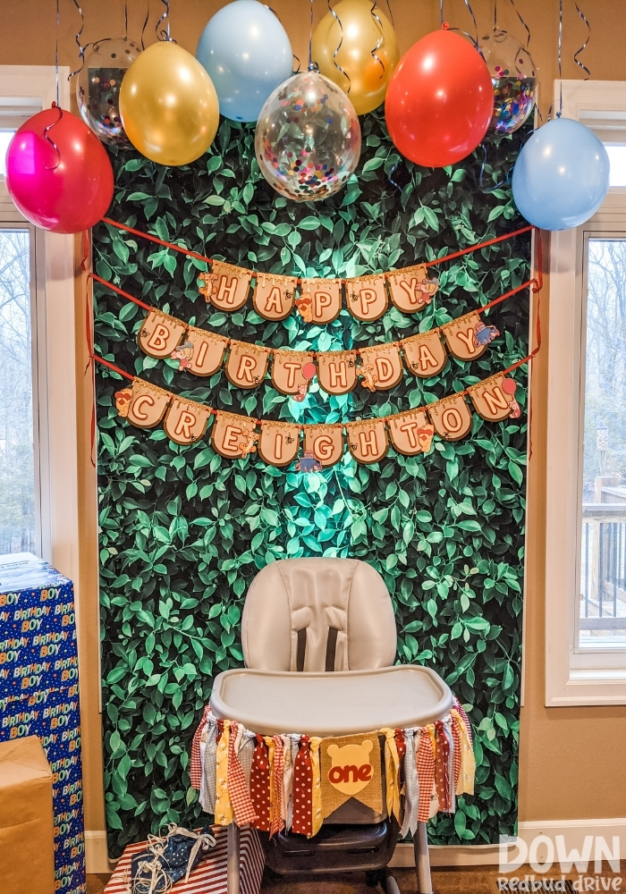 A Winnie The Pooh themed birthday party banner.