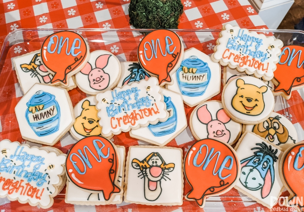 Overhead view of Winnie the Pooh themed cookies.