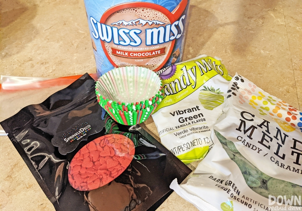 The supplies for the Grinch Hot Chocolate Bombs.