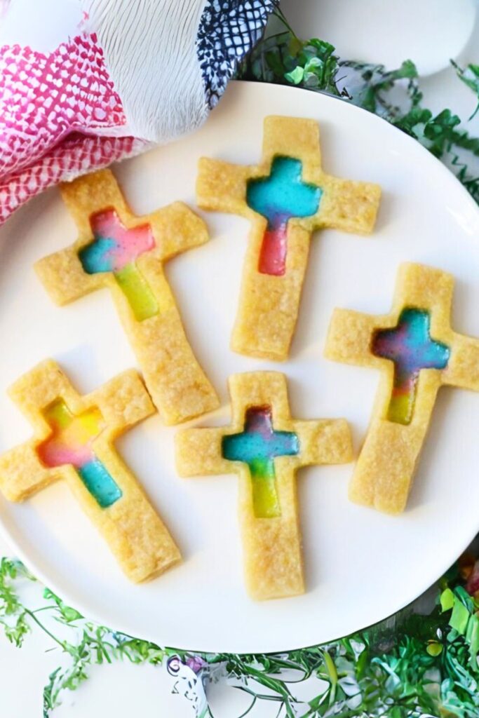 finished stained glass sugar cookies in the shape of crosses with a candy center of various colors