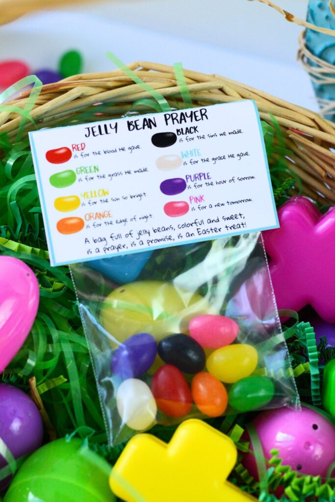 Finished jelly bean prayer bag with printable label sitting in an easter basket with other treats