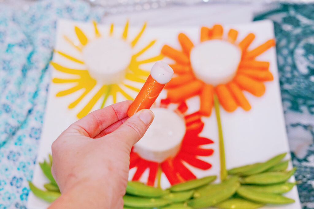 carrot dipped in ranch dressing veggie flower tray