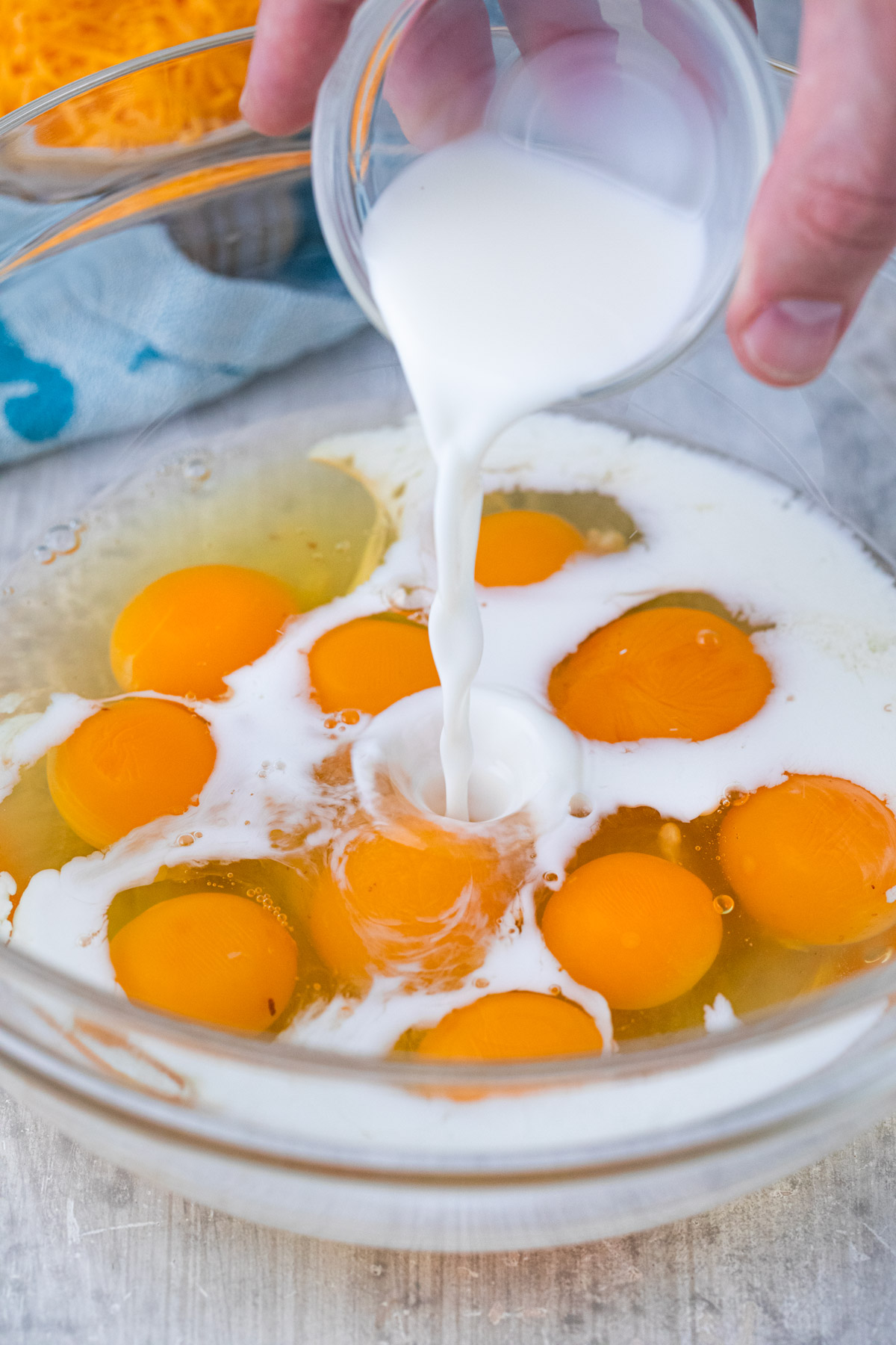 mixing eggs and milk 