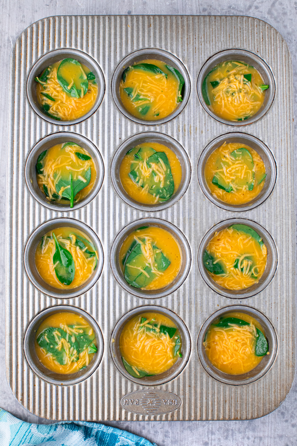 egg bites mixture 3/4 full in muffin pan 