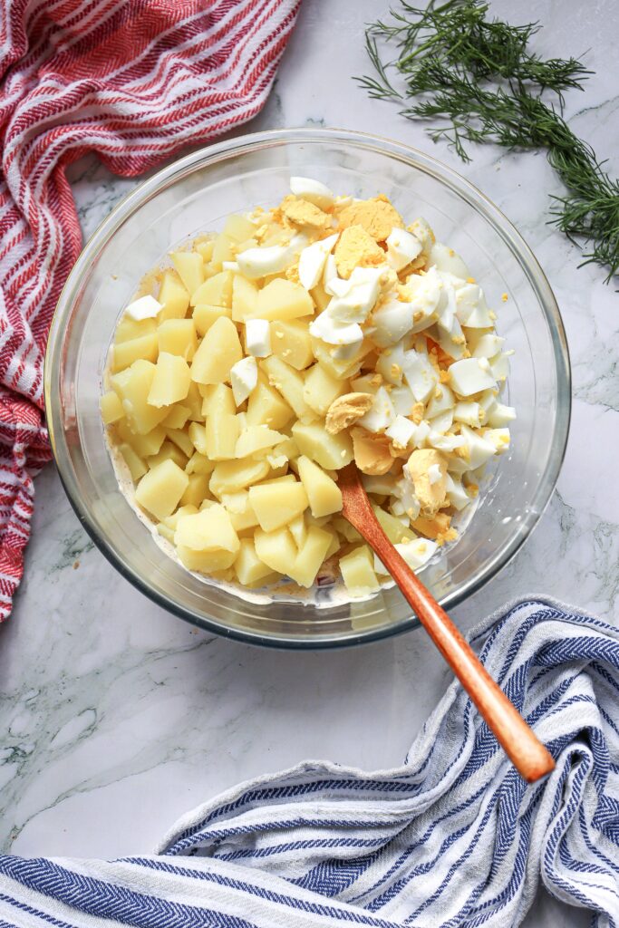 mixing 4th of July potato salad