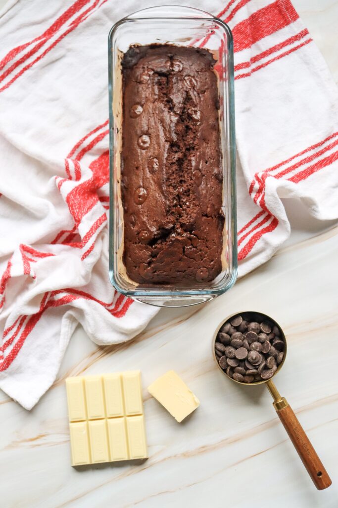 baked chocolate loaf adding drizzle